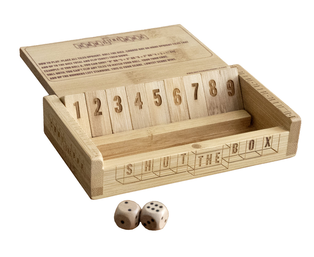 Shut the Box bamboo dice game open showing numbered tiles and dice